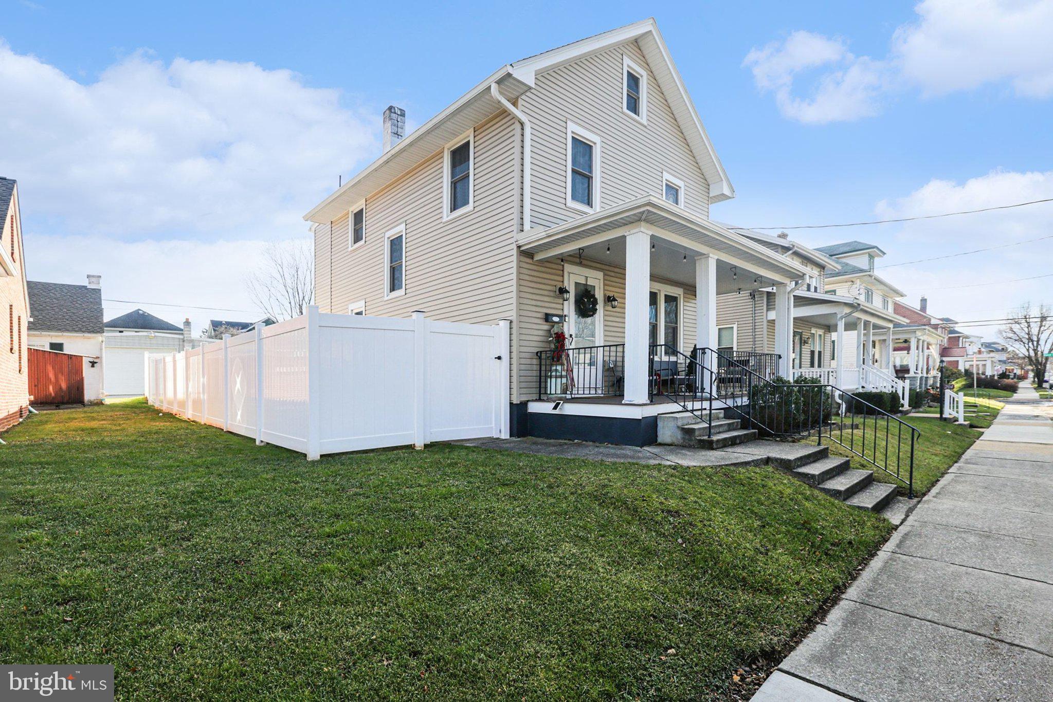 206 East Simpson Street Mechanicsburg, PA 17055 - Photo 2 of 30 a view of a house with a yard and sitting area
