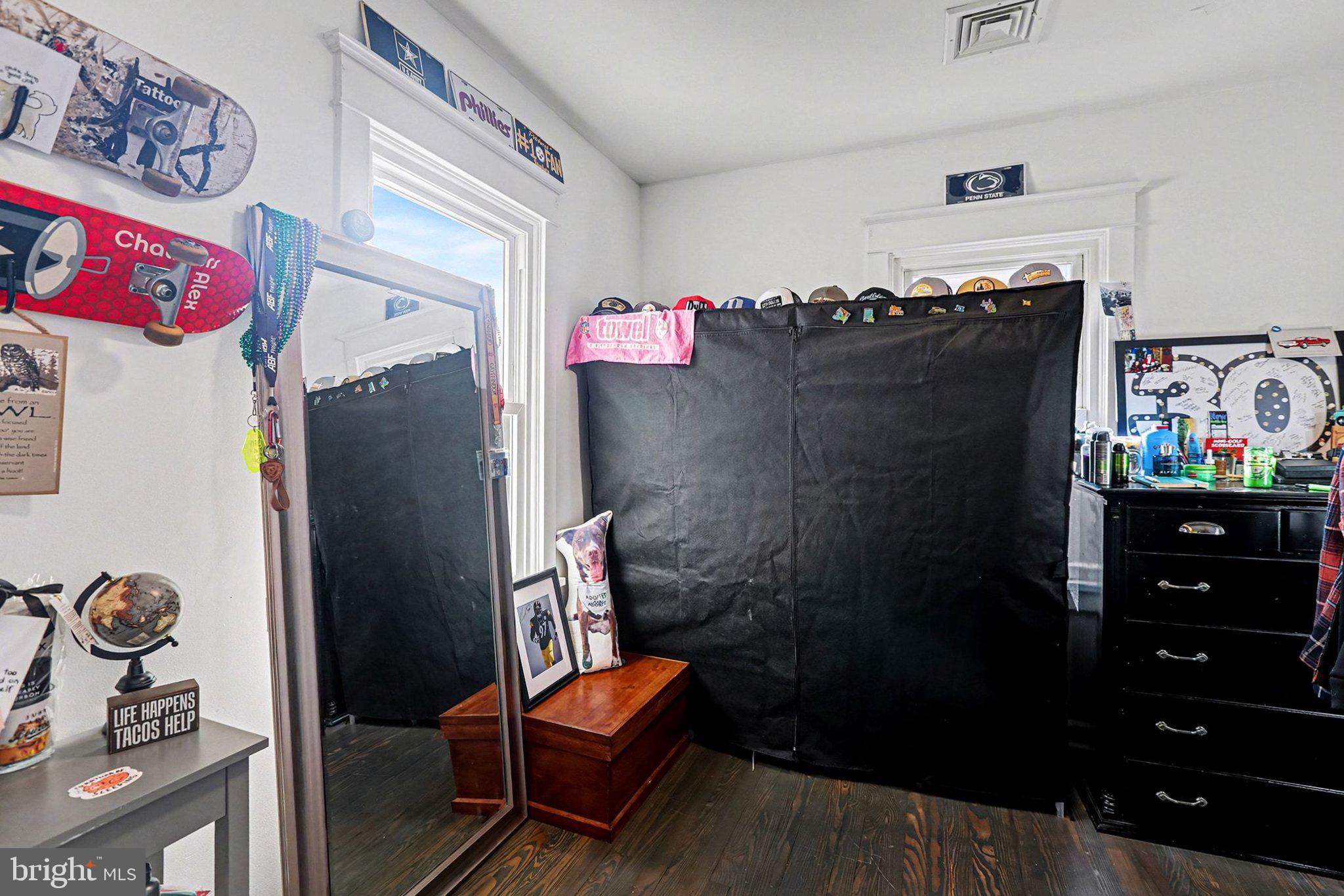 206 East Simpson Street Mechanicsburg, PA 17055 - Photo 23 of 30 a bathroom with a refrigerator and a dresser