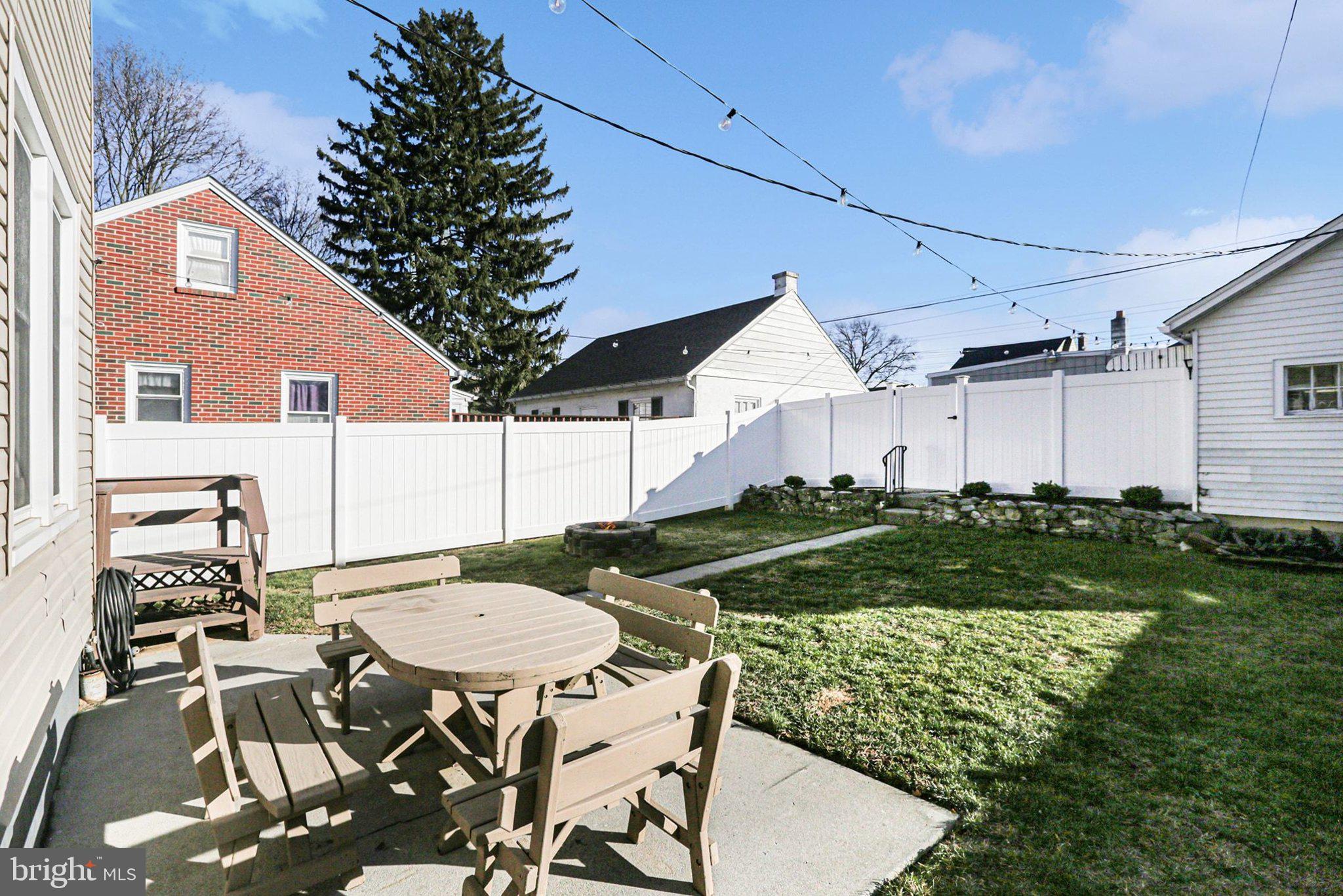 206 East Simpson Street Mechanicsburg, PA 17055 - Photo 27 of 30 a backyard of a house with table and chairs