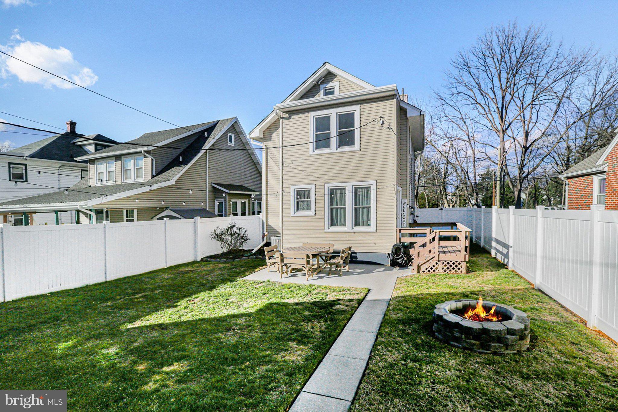 206 East Simpson Street Mechanicsburg, PA 17055 - Photo 29 of 30 a front view of a house with a yard table and chairs