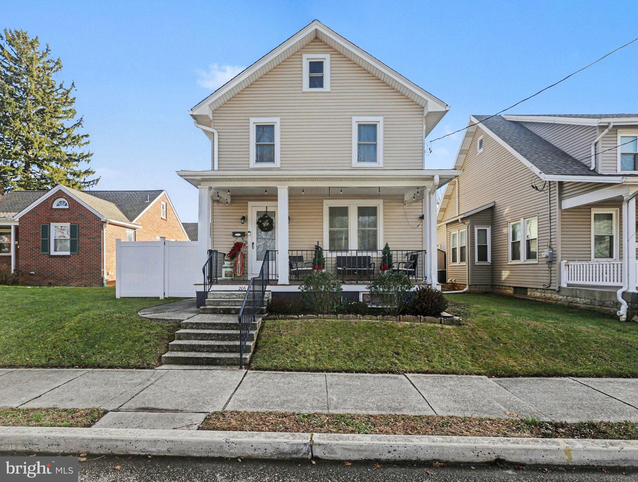 206 East Simpson Street Mechanicsburg, PA 17055 - Photo 4 of 30 a front view of a house with a yard