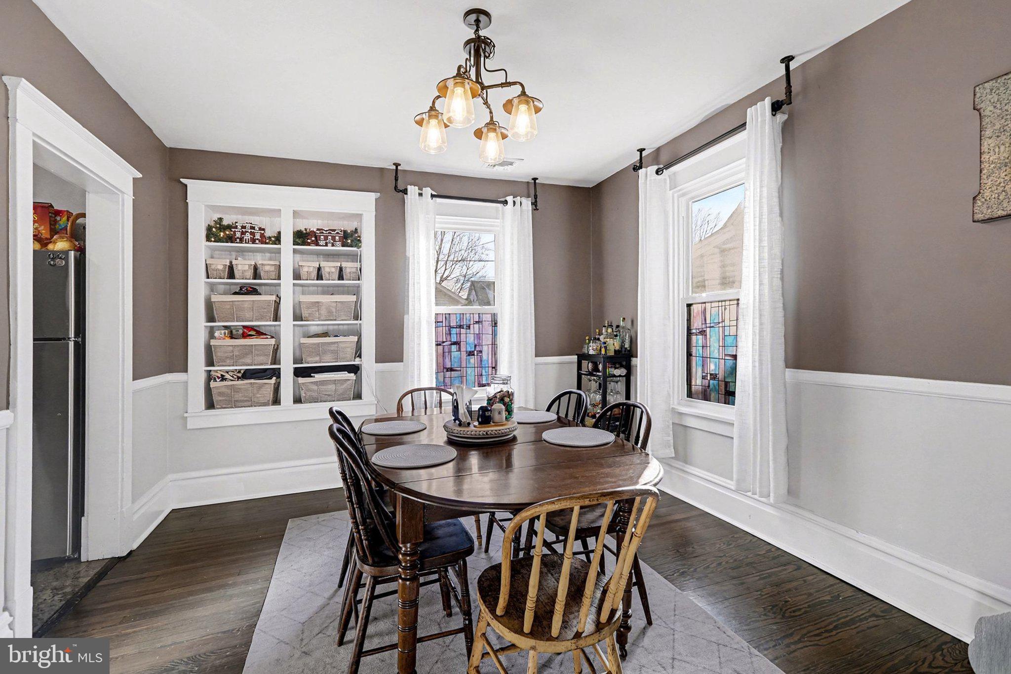 206 East Simpson Street Mechanicsburg, PA 17055 - Photo 10 of 30 a view of a dining room with furniture window and wooden floor