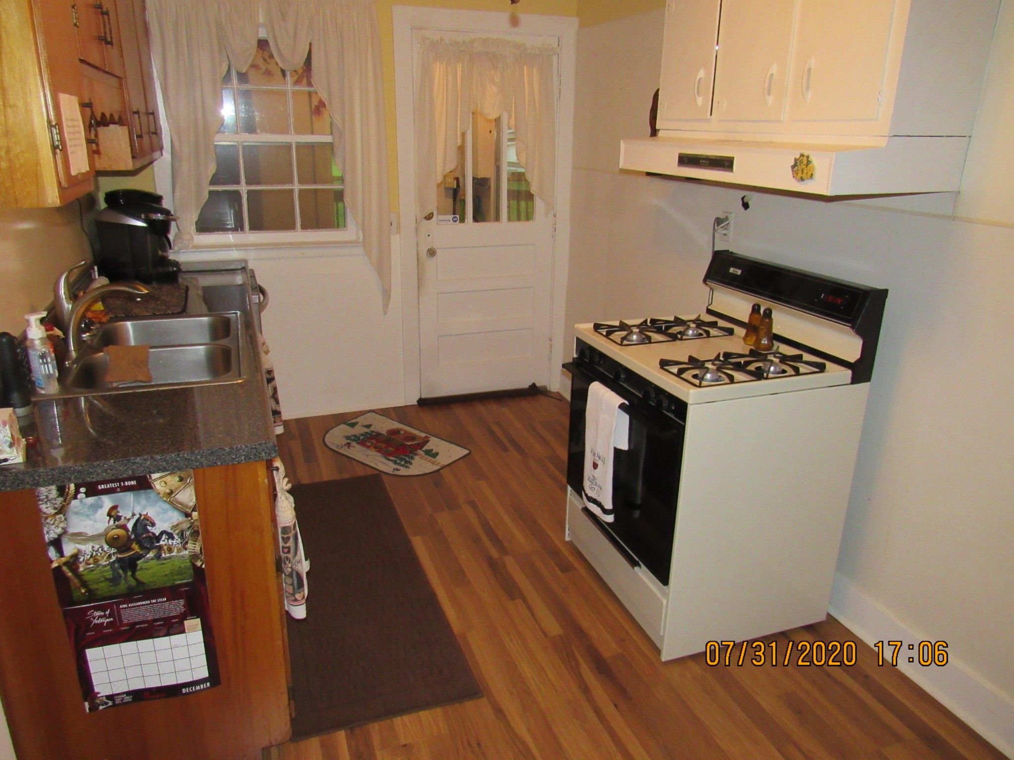 1207 Spring Street Lancing, TN 37770 - Photo 13 of 19 a kitchen with granite countertop a stove and a sink