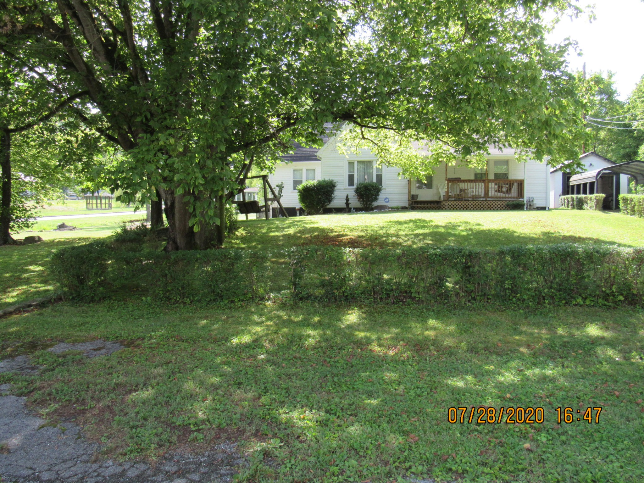 1207 Spring Street Lancing, TN 37770 - Photo 2 of 19 a view of a house with a yard