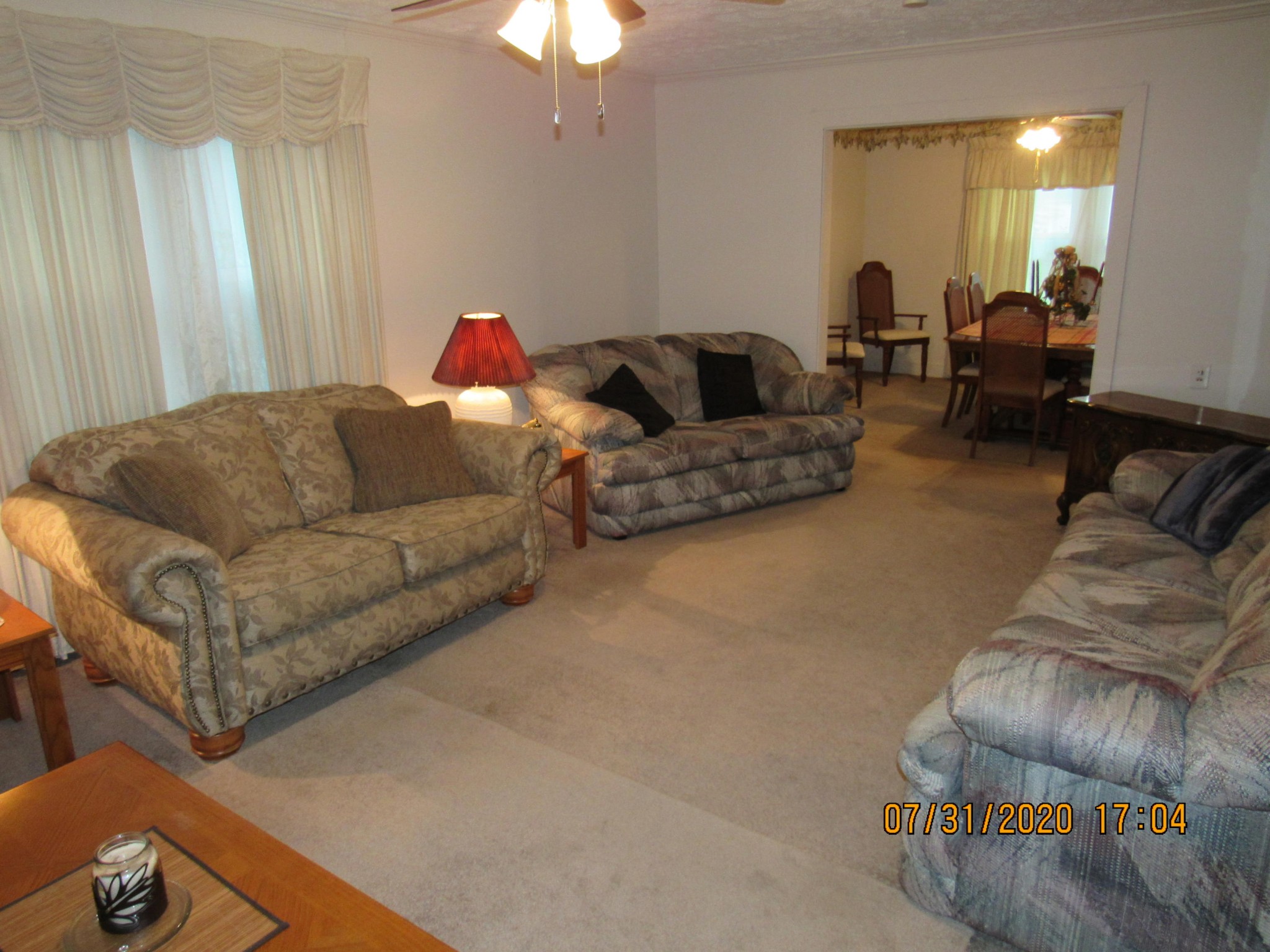 1207 Spring Street Lancing, TN 37770 - Photo 9 of 19 a living room with furniture ceiling fan and a rug