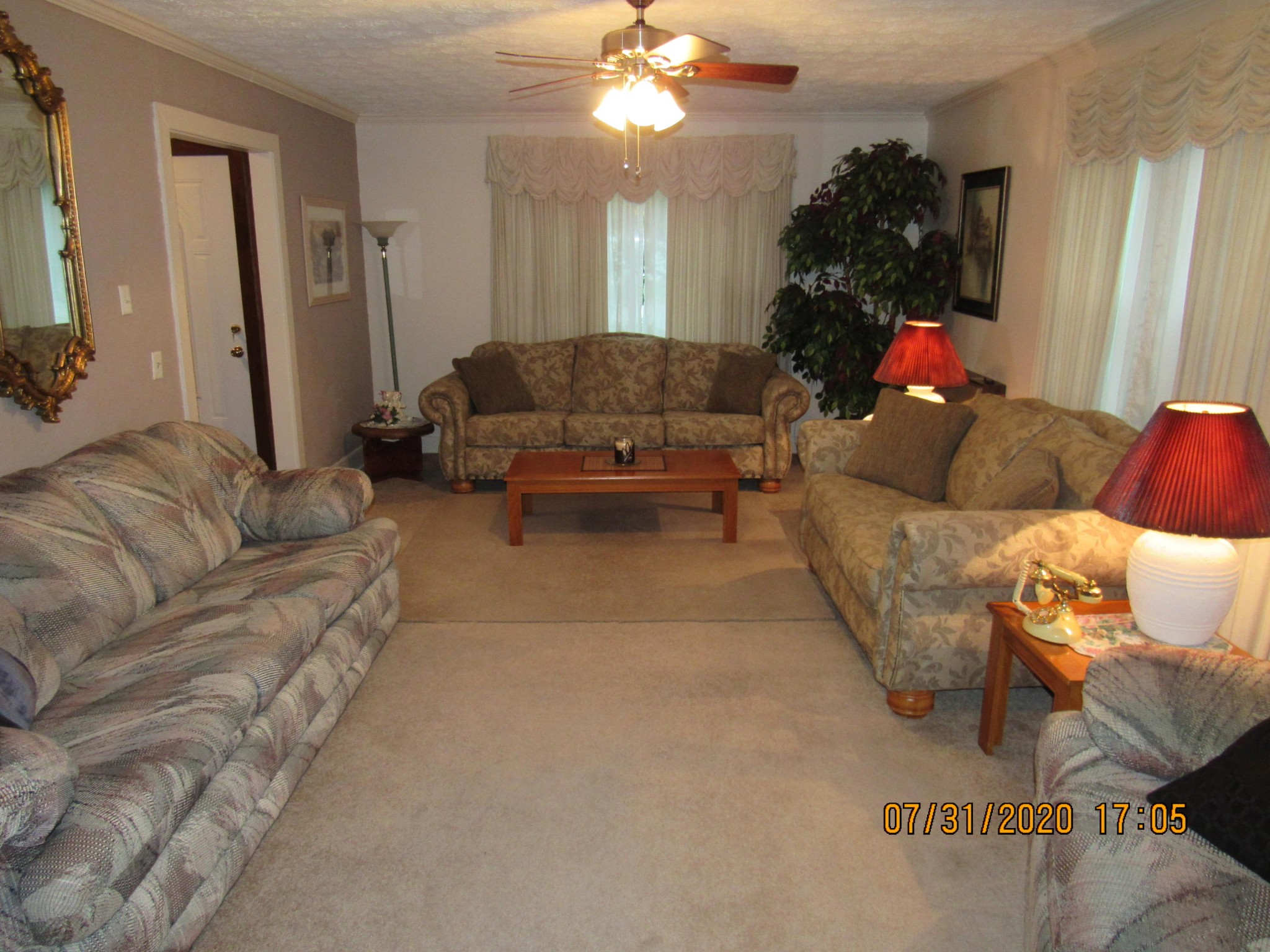 1207 Spring Street Lancing, TN 37770 - Photo 10 of 19 a living room with furniture and a large mirror