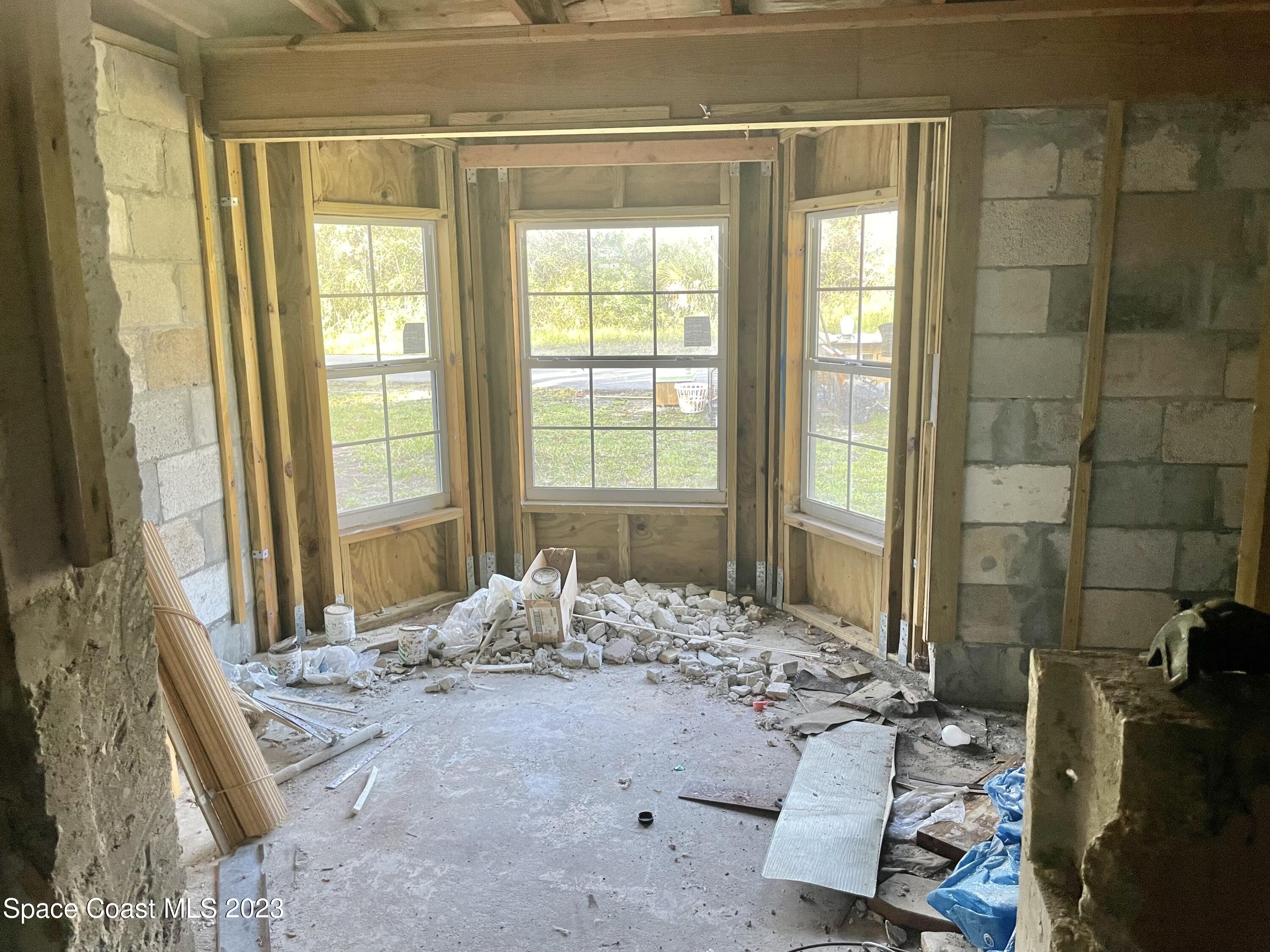 2245 Commodore Boulevard Melbourne, FL 32904 - Photo 11 of 15 a living room with a large window