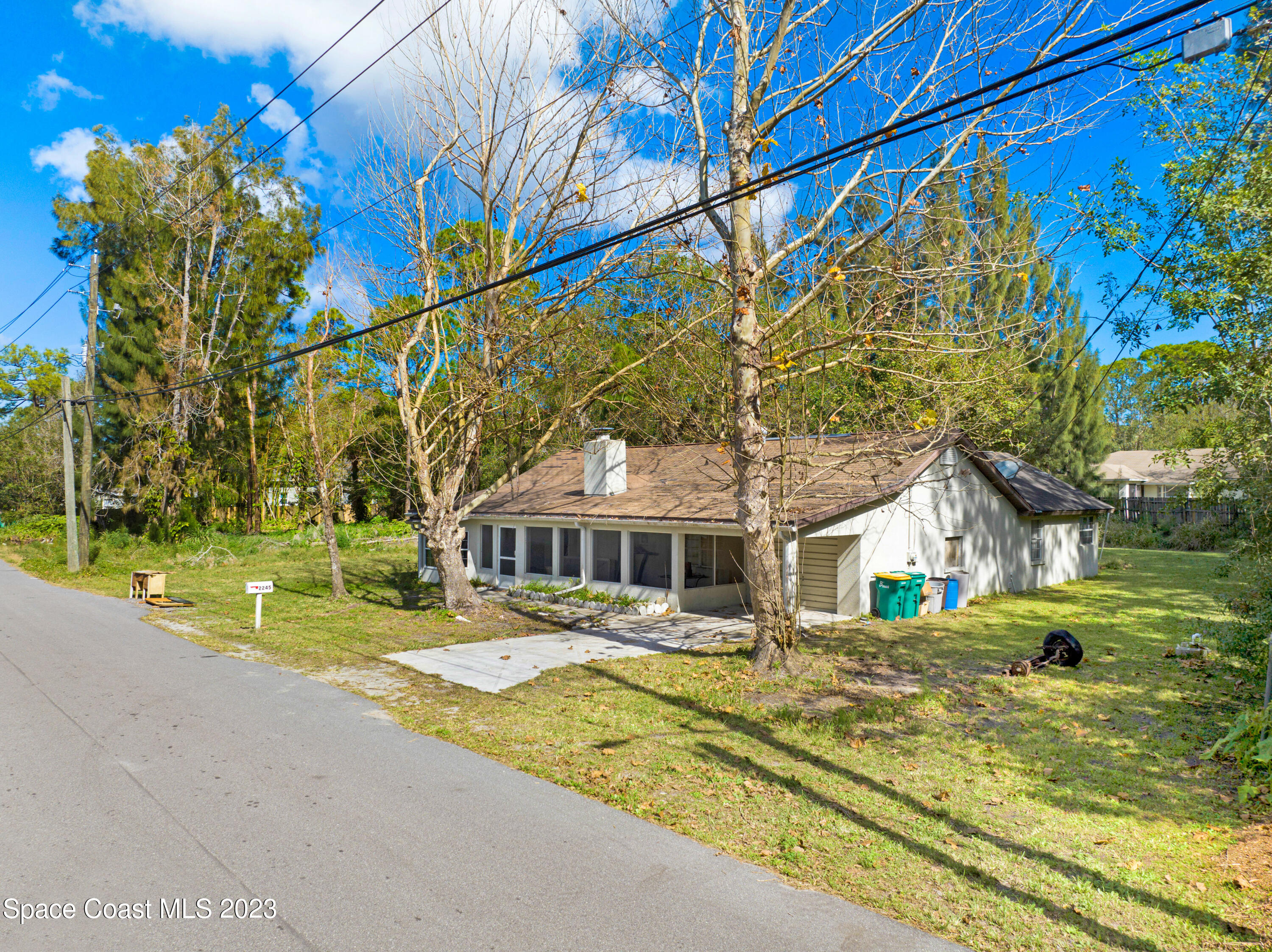 2245 Commodore Boulevard Melbourne, FL 32904 - Photo 3 of 15 a view of swimming pool with outdoor seating and yard