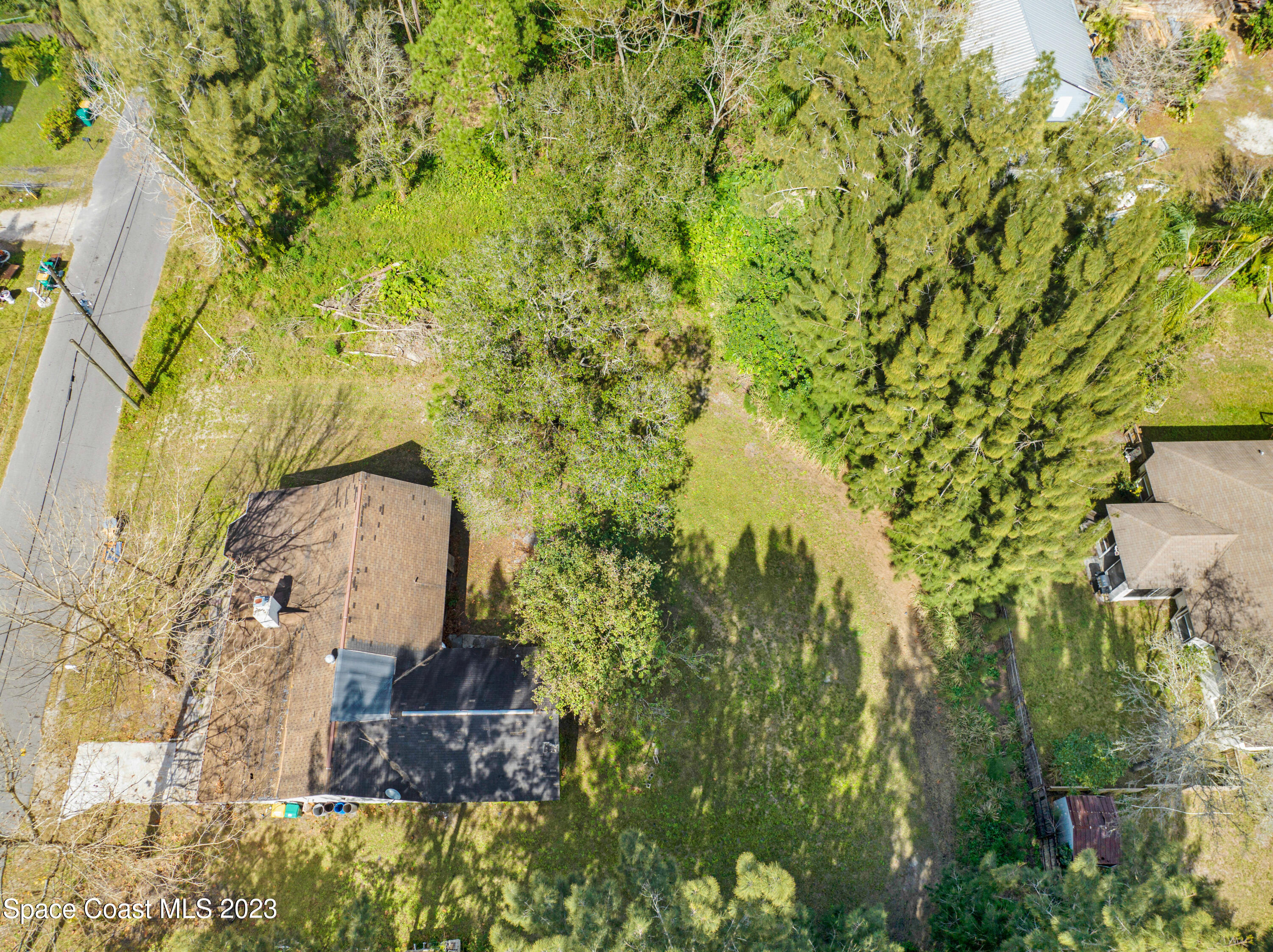 2245 Commodore Boulevard Melbourne, FL 32904 - Photo 6 of 15 a aerial view of a residential houses with yard