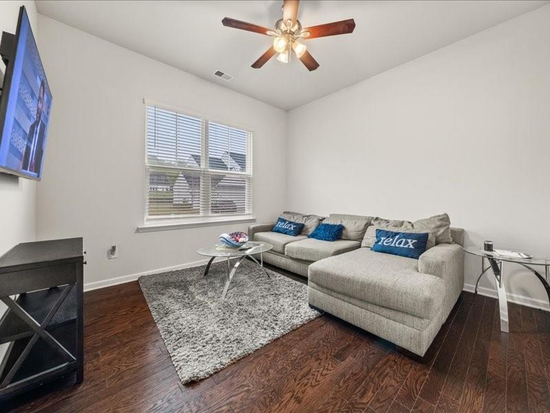 1395 Crestwind Road Northwest Kennesaw, GA 30152 - Photo 11 of 35 a living room with furniture and a window