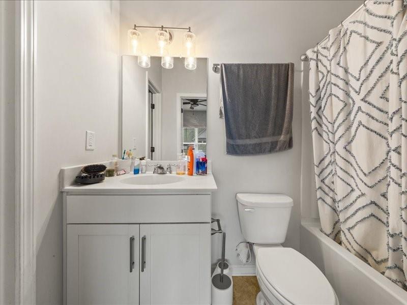 1395 Crestwind Road Northwest Kennesaw, GA 30152 - Photo 20 of 35 a bathroom with a sink mirror vanity and toilet
