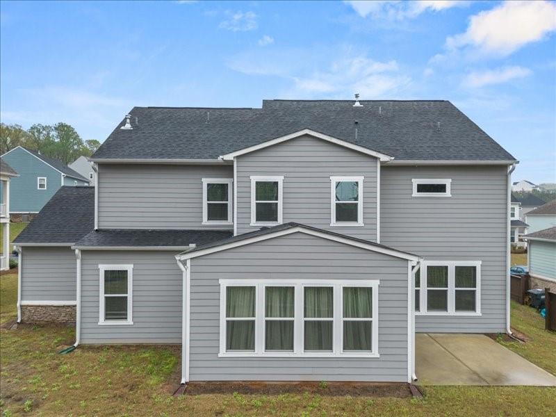 1395 Crestwind Road Northwest Kennesaw, GA 30152 - Photo 26 of 35 a front view of a house with a yard