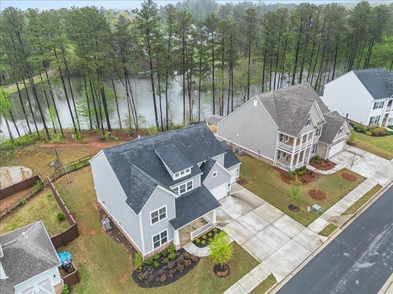 1395 Crestwind Road Northwest Kennesaw, GA 30152 - Photo 32 of 35 a view of a house with pool and a yard