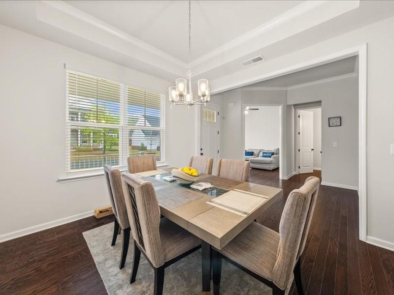 1395 Crestwind Road Northwest Kennesaw, GA 30152 - Photo 4 of 35 a view of a dining room with furniture window and wooden floor