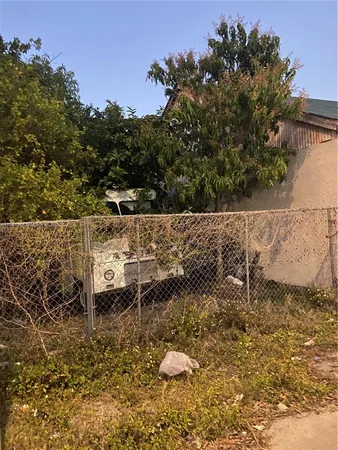 a view of a backyard of the house