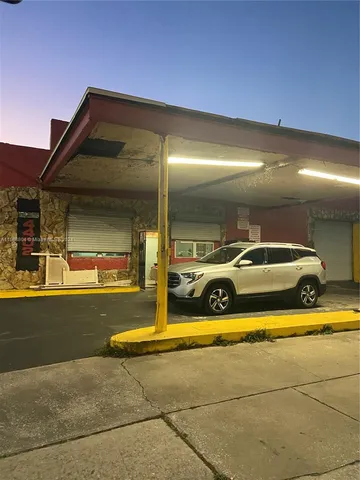 a view of a swimming pool with an outdoor seating