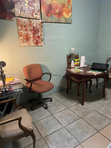 a workspace with furniture and a rug