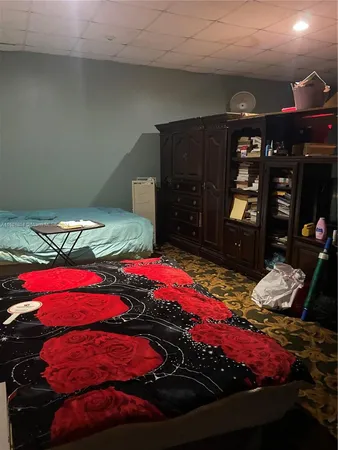 a bedroom with two bed and a closet