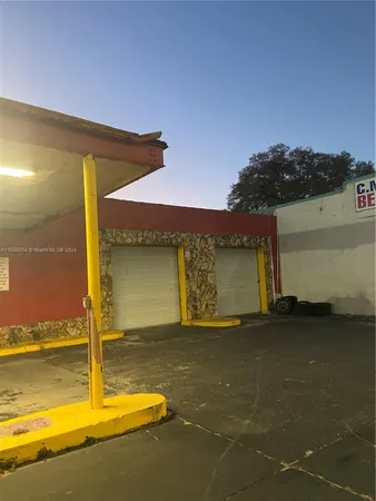 a view of a swimming pool with an outdoor space and seating area