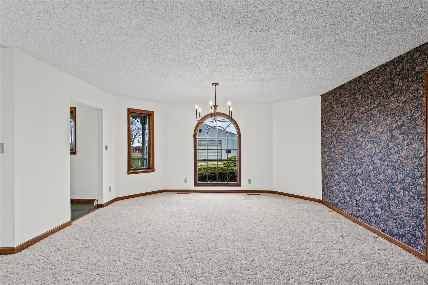 7961 North 3000 E Road Forrest, IL 61741 - Photo 10 of 66 a view of a room with window wooden floor and front door