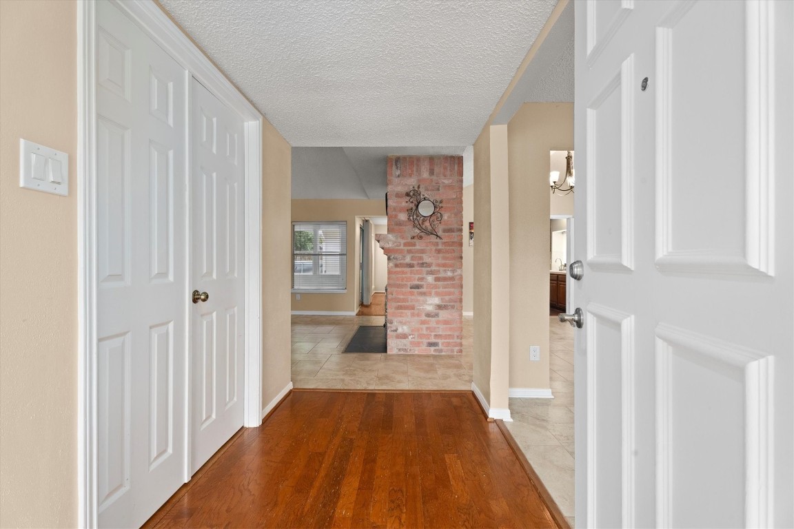 6907 Five Forks Drive Spring, TX 77379 - Photo 7 of 45 Welcoming foyer with real wood floors and view into main living areas.