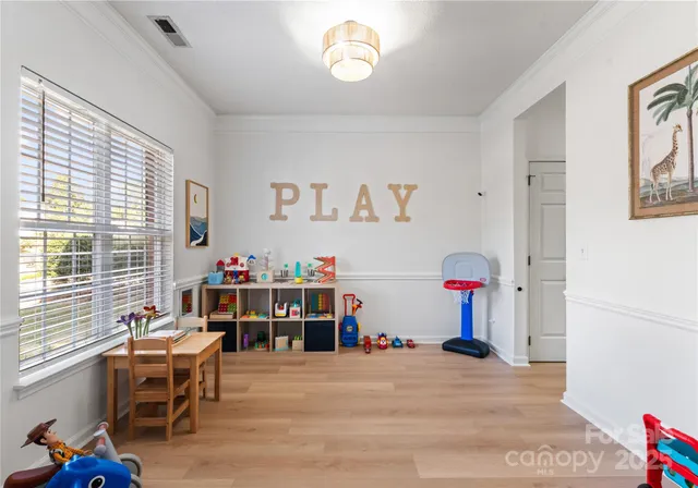 a view of a livingroom with furniture and a window