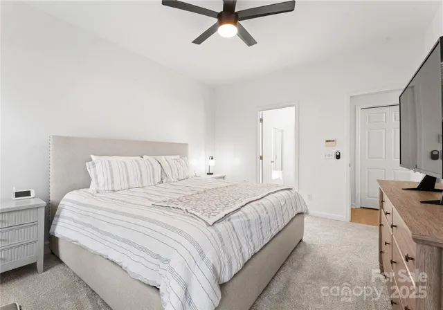 a bedroom with a bed and a cabinets