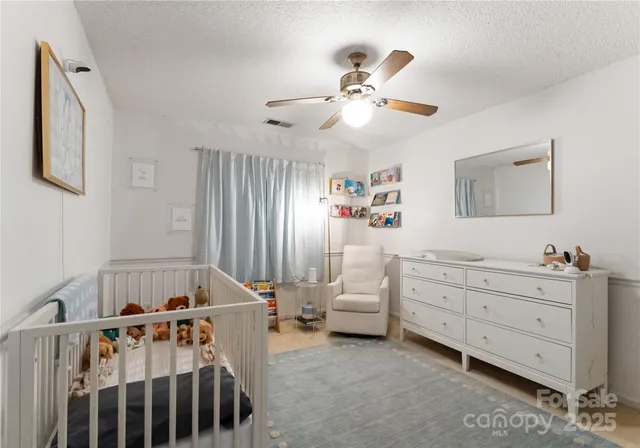 a bedroom with furniture and window