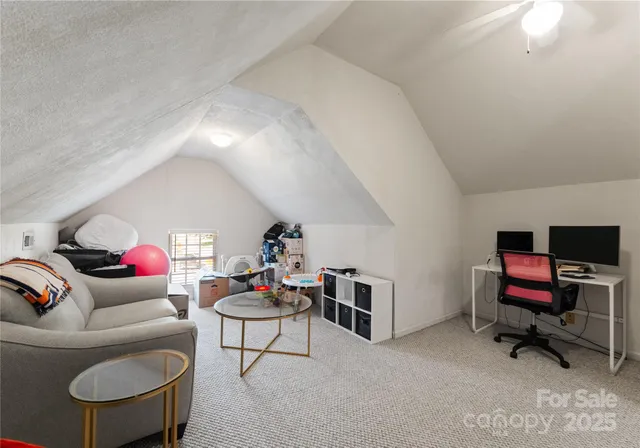 a living room with furniture and a piano