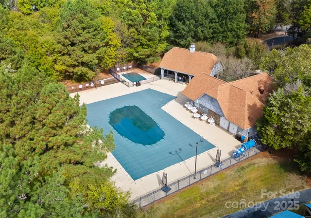 an aerial view of a house with outdoor space