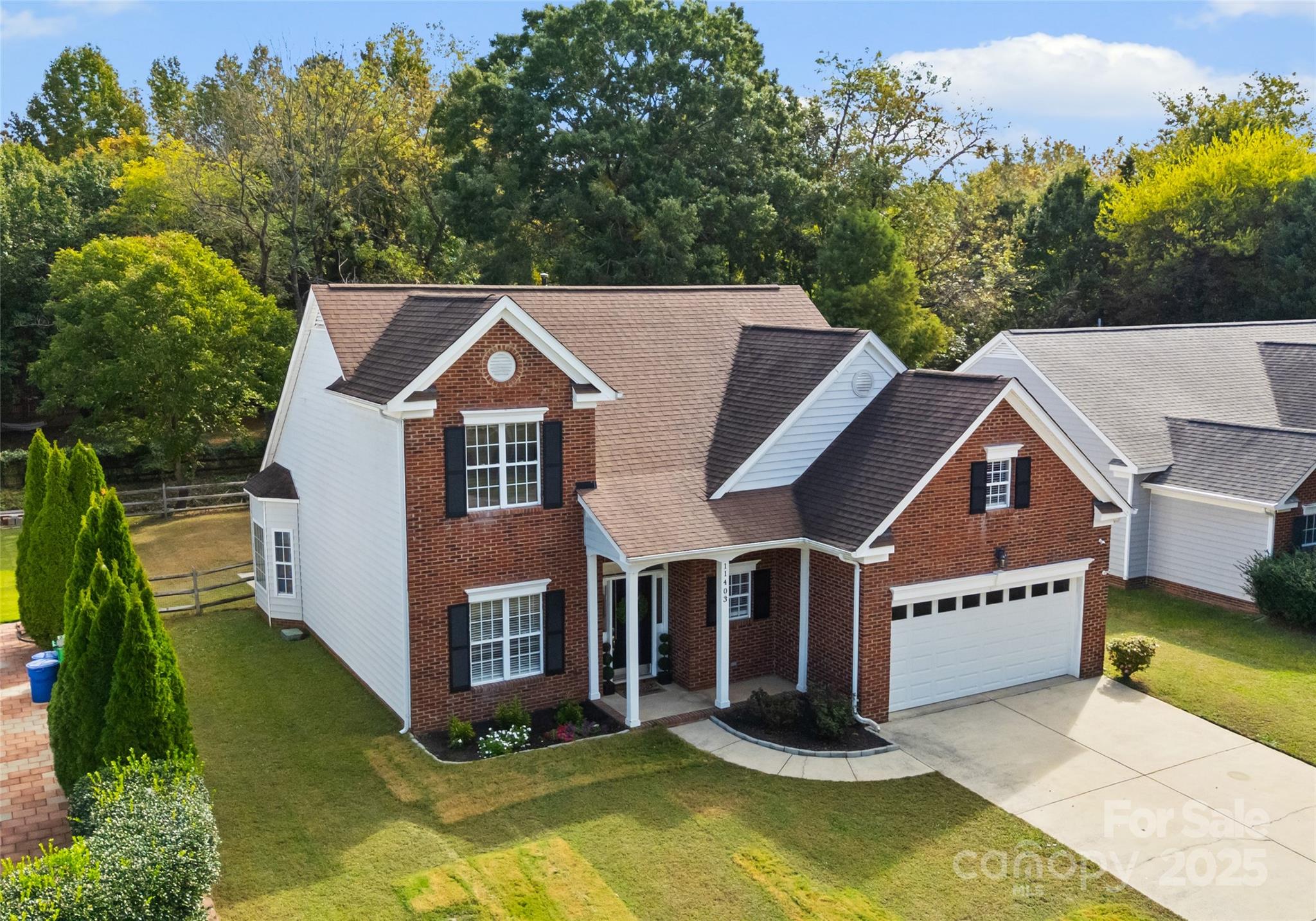 11403 Ridge Oak Drive Charlotte, NC 28273 - Photo 38 of 45 a aerial view of a house in a big yard with large trees