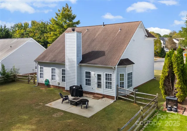 a view of a house with pool porch and sitting area