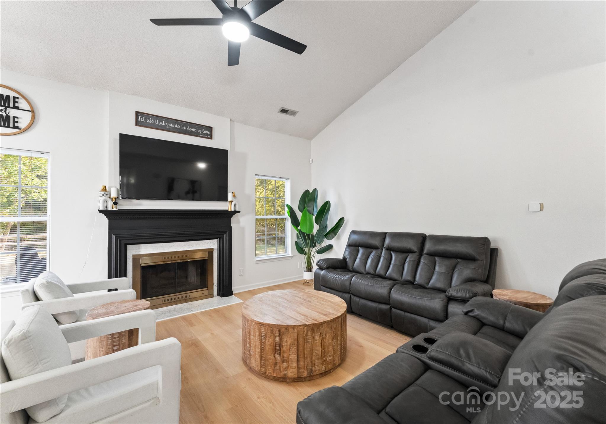 11403 Ridge Oak Drive Charlotte, NC 28273 - Photo 5 of 45 a living room with furniture and a fireplace