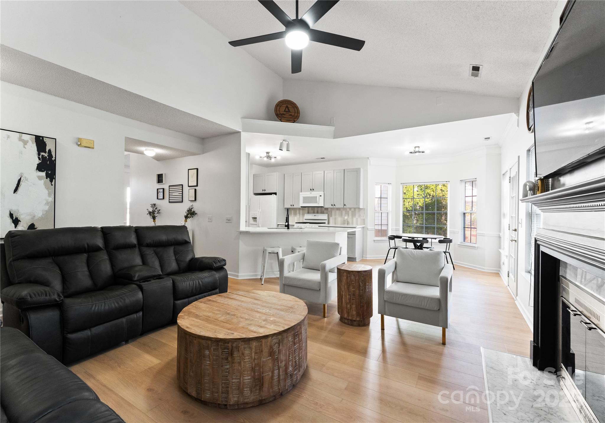 11403 Ridge Oak Drive Charlotte, NC 28273 - Photo 6 of 45 a living room with furniture and a fireplace