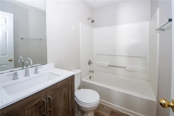 a bathroom with a sink a toilet and a bathtub
