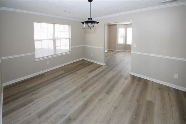 a view of an empty room with stairs