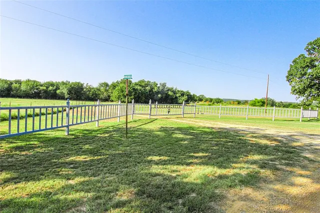 a view of a golf course with a lake view