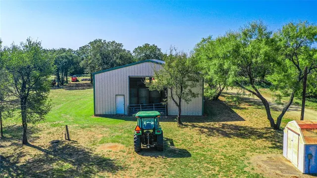 a view of a backyard with a small cabin