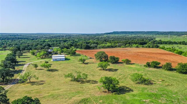 a backyard of a house with a yard and lake view