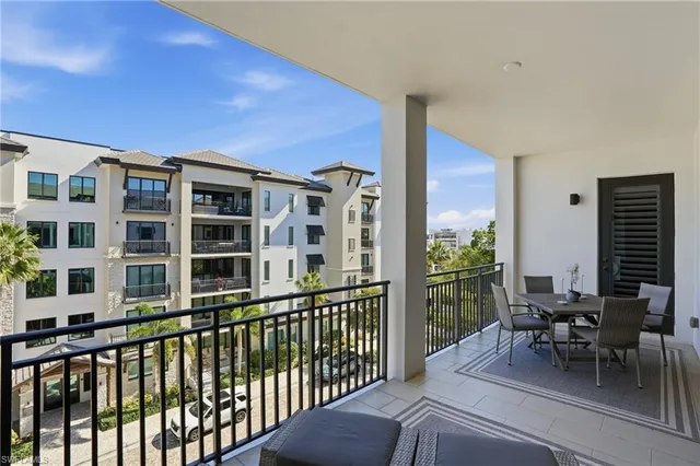 a view of a patio with a dining table and chairs with a patio