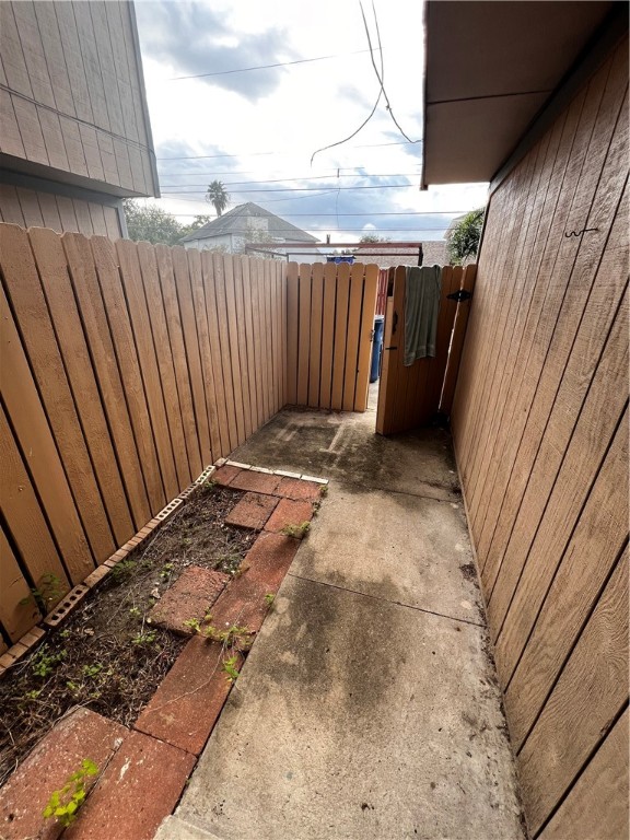 5180 Middlecoff Circle, Unit B Corpus Christi, TX 78413 - Photo 11 of 11 a view of wooden fence