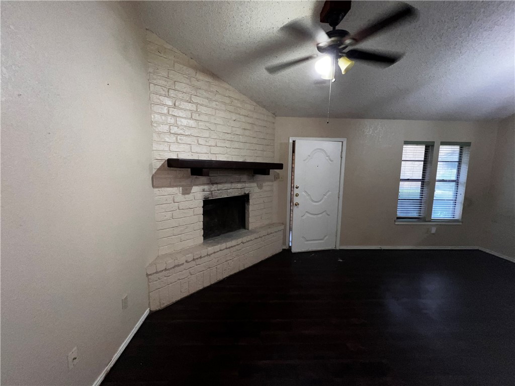 5180 Middlecoff Circle, Unit B Corpus Christi, TX 78413 - Photo 4 of 11 a view of empty room with wooden floor and fan
