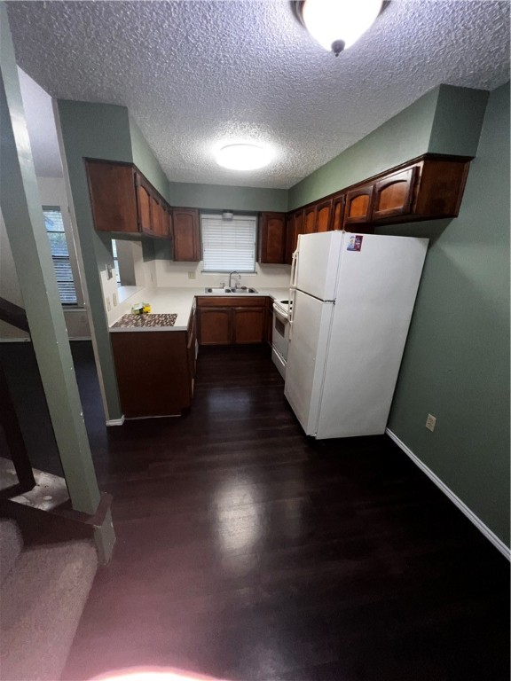5180 Middlecoff Circle, Unit B Corpus Christi, TX 78413 - Photo 5 of 11 a view of kitchen and utility room with wooden floor