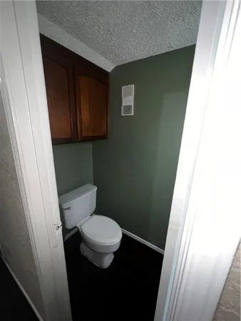 a bathroom with a toilet and a sink