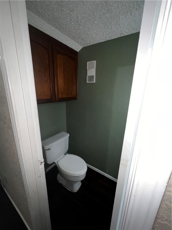 5180 Middlecoff Circle, Unit B Corpus Christi, TX 78413 - Photo 7 of 11 a bathroom with a toilet and a sink