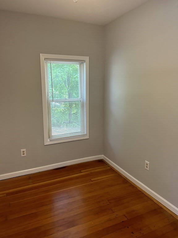 46 Tatman Street Worcester, MA 01607 - Photo 12 of 31 a view of a room with wooden floor and window