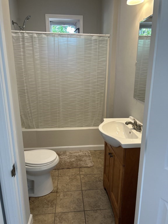 46 Tatman Street Worcester, MA 01607 - Photo 15 of 31 a bathroom with a sink a toilet and shower