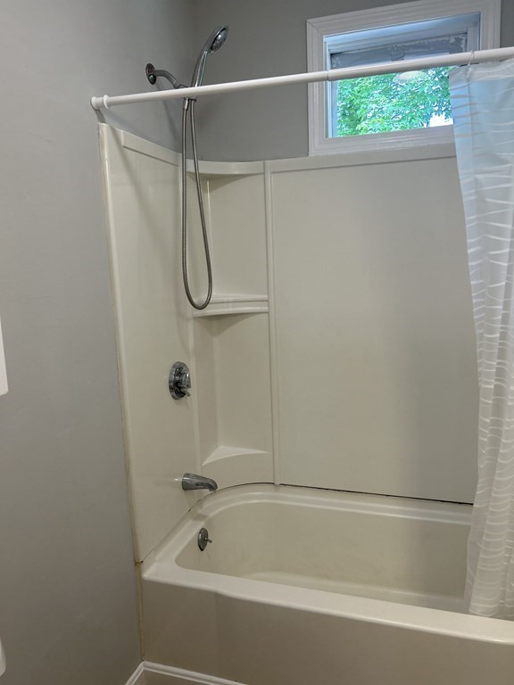 46 Tatman Street Worcester, MA 01607 - Photo 16 of 31 a bathroom with a bathtub and a shower