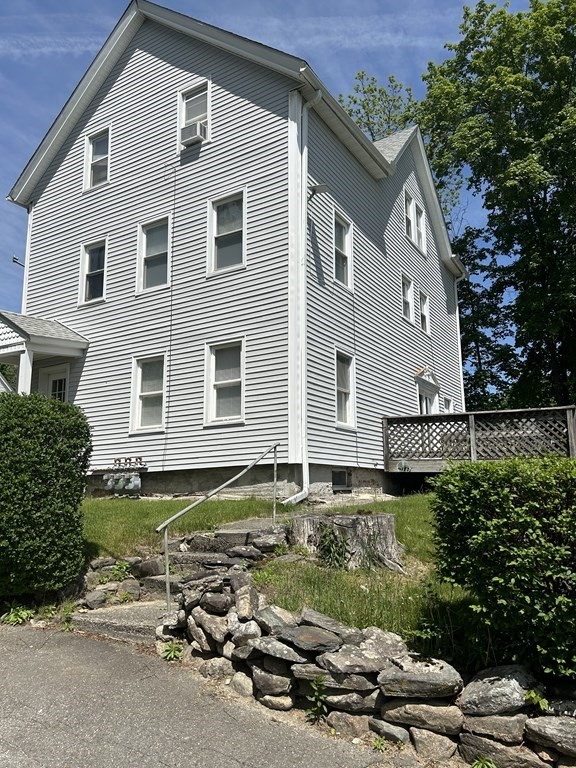 46 Tatman Street Worcester, MA 01607 - Photo 2 of 31 a front view of a house with a yard