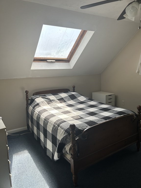 46 Tatman Street Worcester, MA 01607 - Photo 27 of 31 a bed sitting in a bedroom next to a window